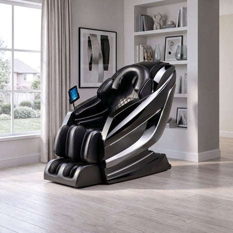 A modern black and silver massage chair with a small side screen, shown in a bright, contemporary living room with light wood floors and built-in shelves.