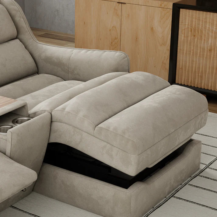 Beige sectional sofa with reclining feature in a room with wooden cabinets.