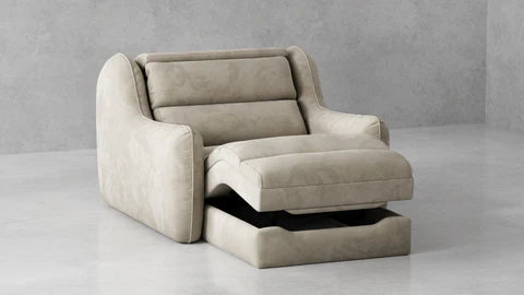 A modern beige upholstered recliner chair with a matching footrest, shown in a minimalist gray studio setting.