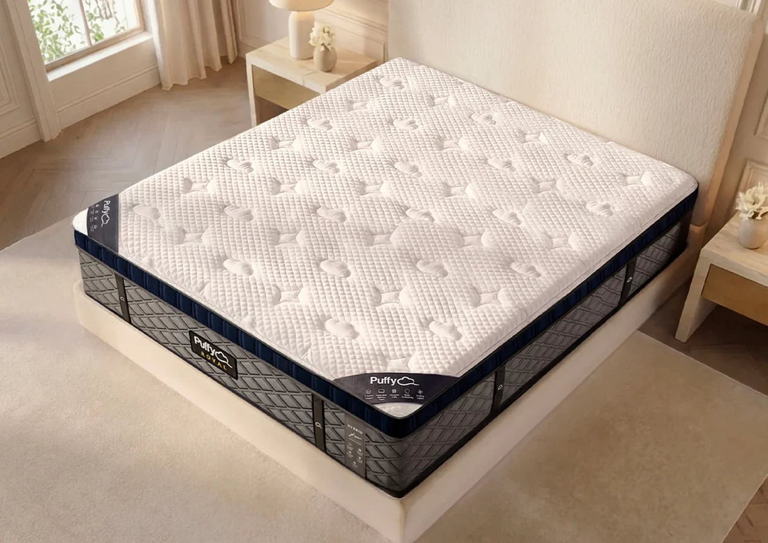 Mattress on a bed in a bedroom setting with 'Puffy' branding.