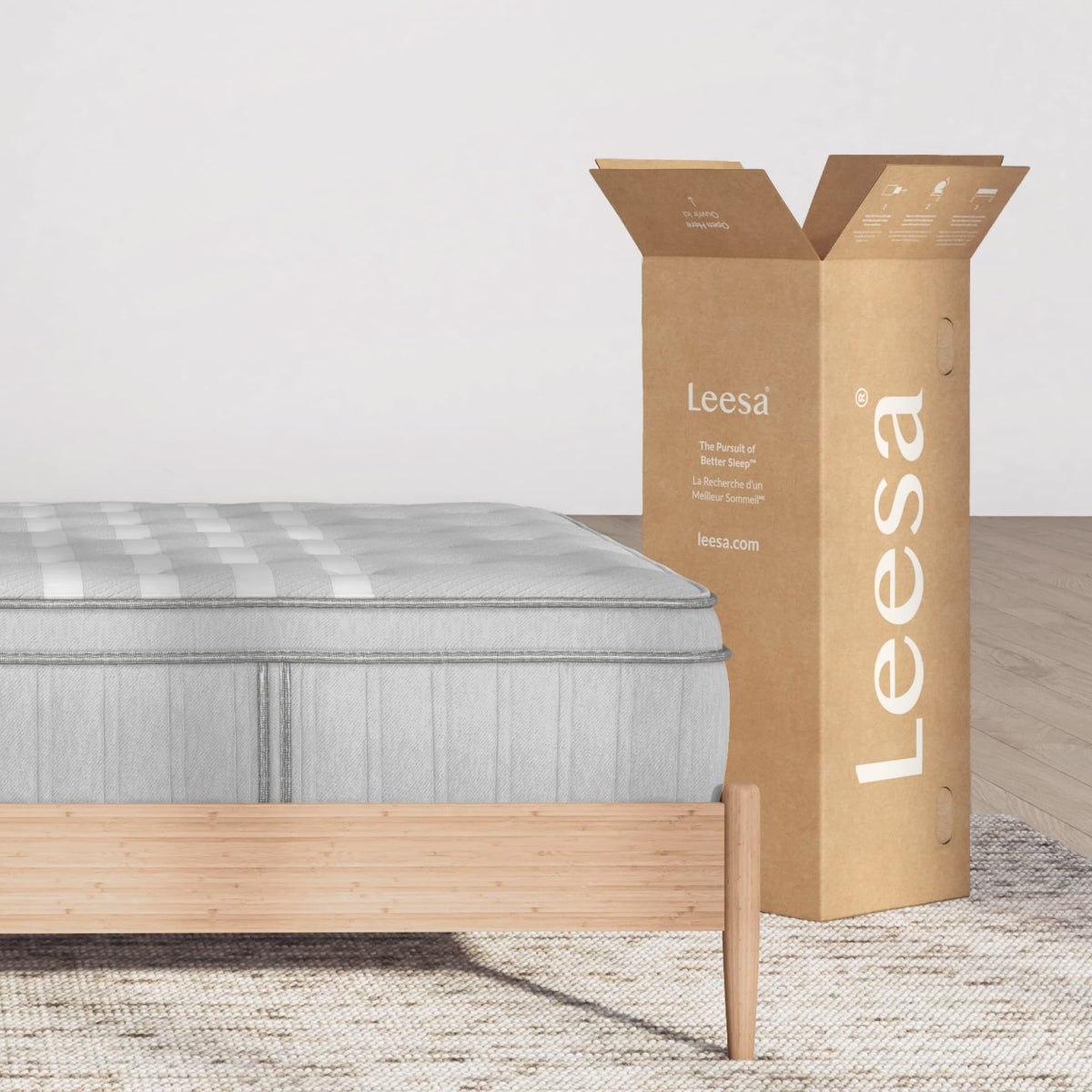 Leesa Plus Hybrid Mattress beside its shipping box